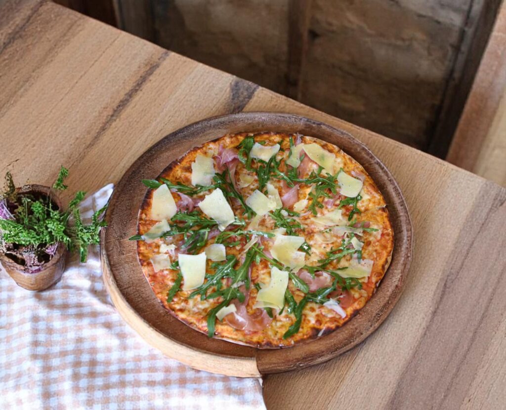 Thin-crust gourmet pizza slice